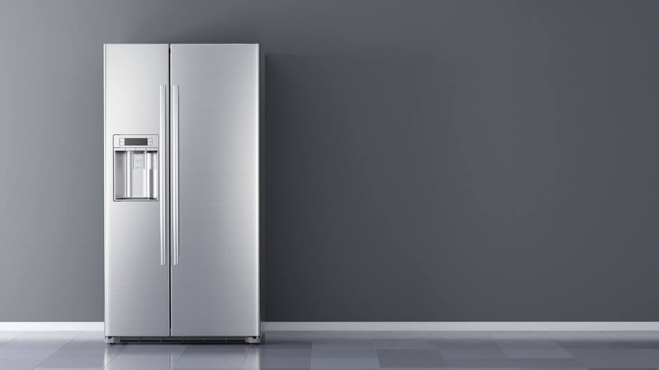 A refrigerator with fridge puns and jokes written on the side