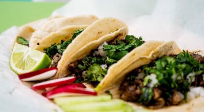 Tacos being served while people share taco puns and jokes