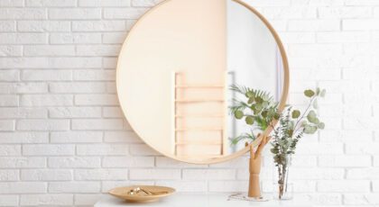 One mirror hanging on a wall