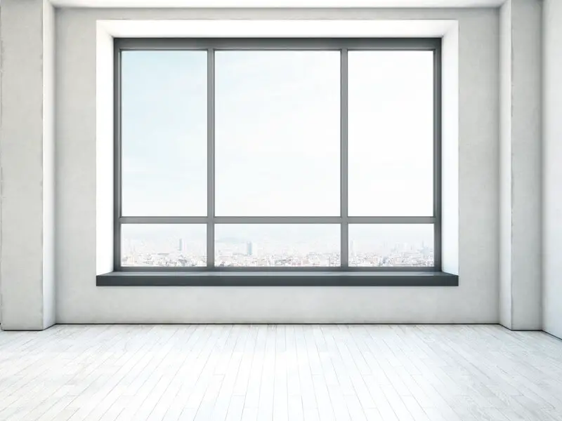 A big window in a room where people are telling window jokes