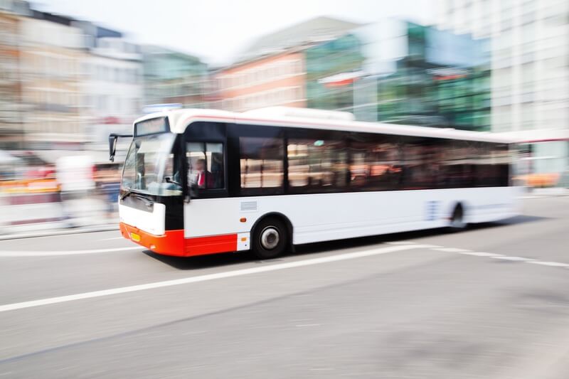 A bus driving to avoid people sharing bus jokes and puns