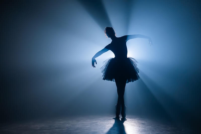 A dancer on stage doing ballet