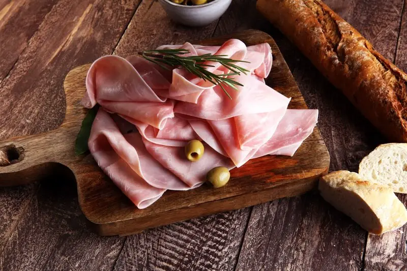 Delicious ham on a table where people are sharing puns and jokes about it