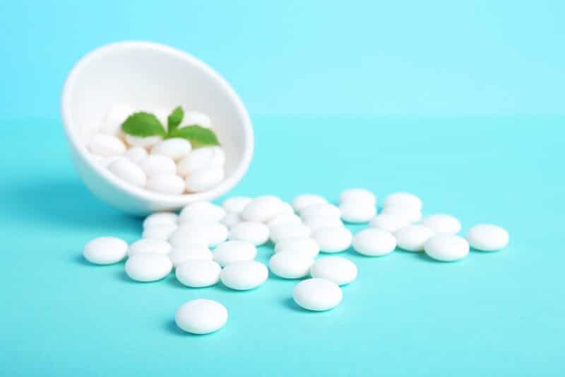 Mints on a table where people are telling each other puns and jokes